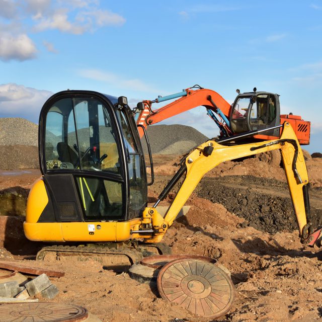 Mini,excavator,during,earthmoving,at,construction,site.,backhoe,dig,ground